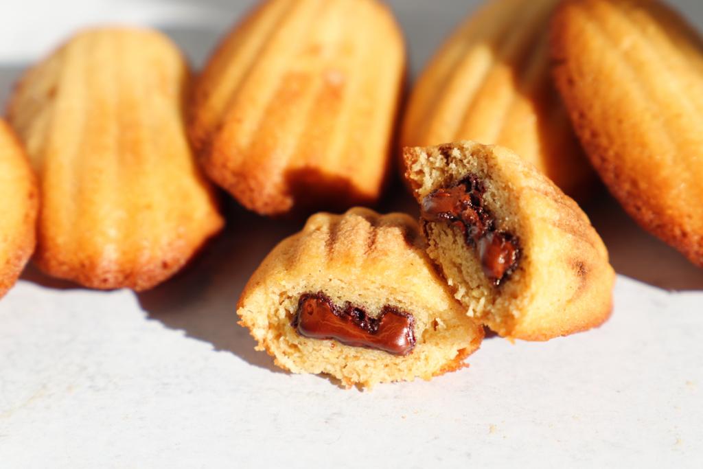 Aesthetic Image of Vegan Madeleines filled with Rich Valrhona Chocolate - L'Artisane Creative Bakery.